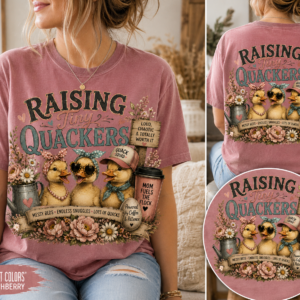 Woman wearing a dusty rose “Raising Tiny Quackers” graphic tee featuring adorable ducklings, farmhouse florals, and vintage country-inspired artwork with front and back shirt views.